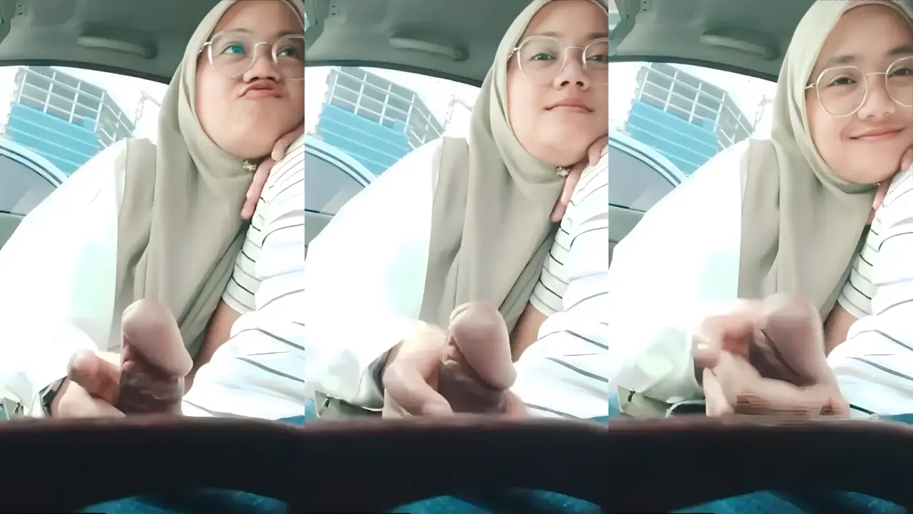 Beautiful-Innocent-Looking-Nerdy-Hijabi-Indonesian-Girl-Strokes-Her-Mans-Dick-In-His-Car